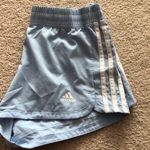 light blue Adidas running shorts